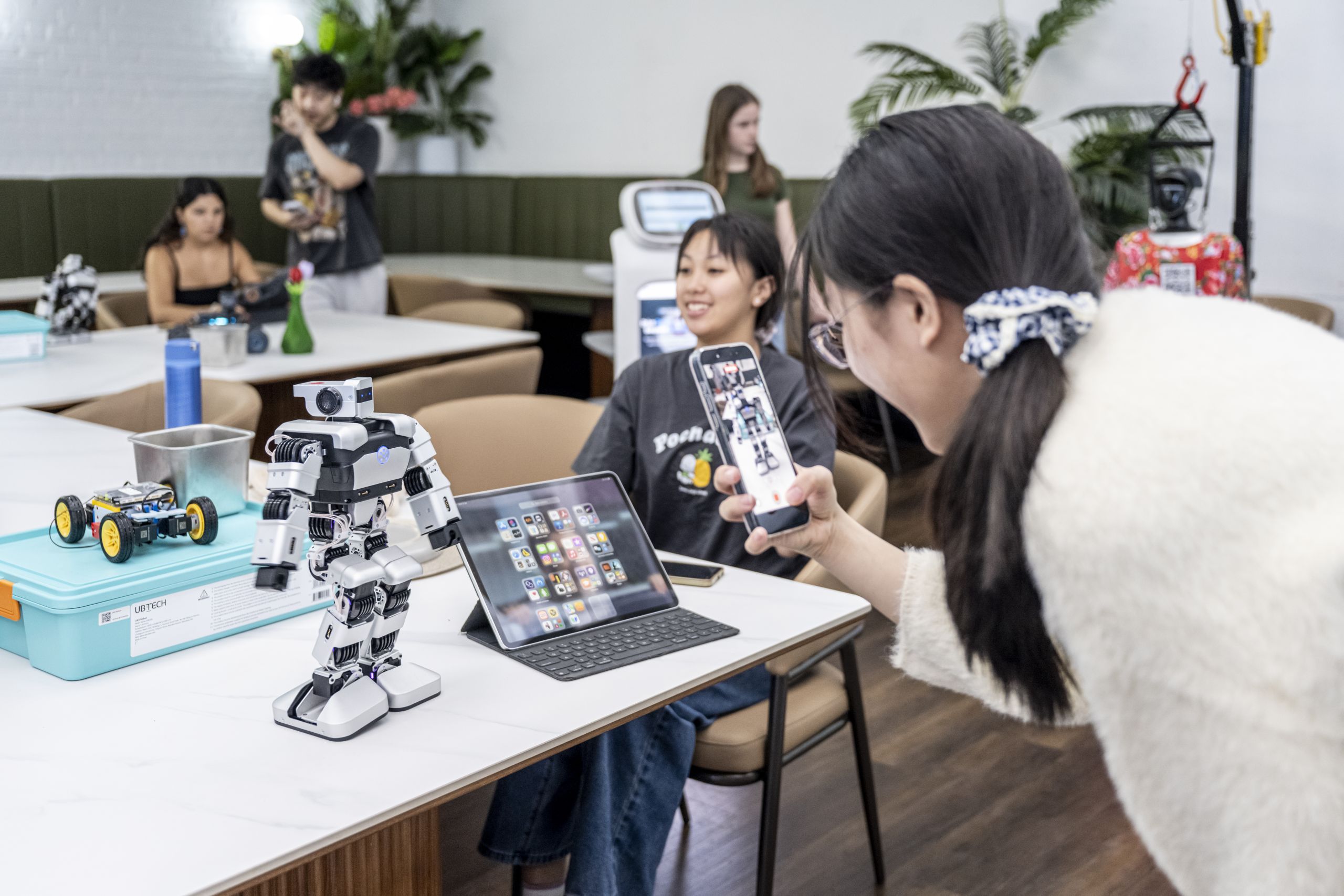 Student photographing the Yanshee humanoid robot