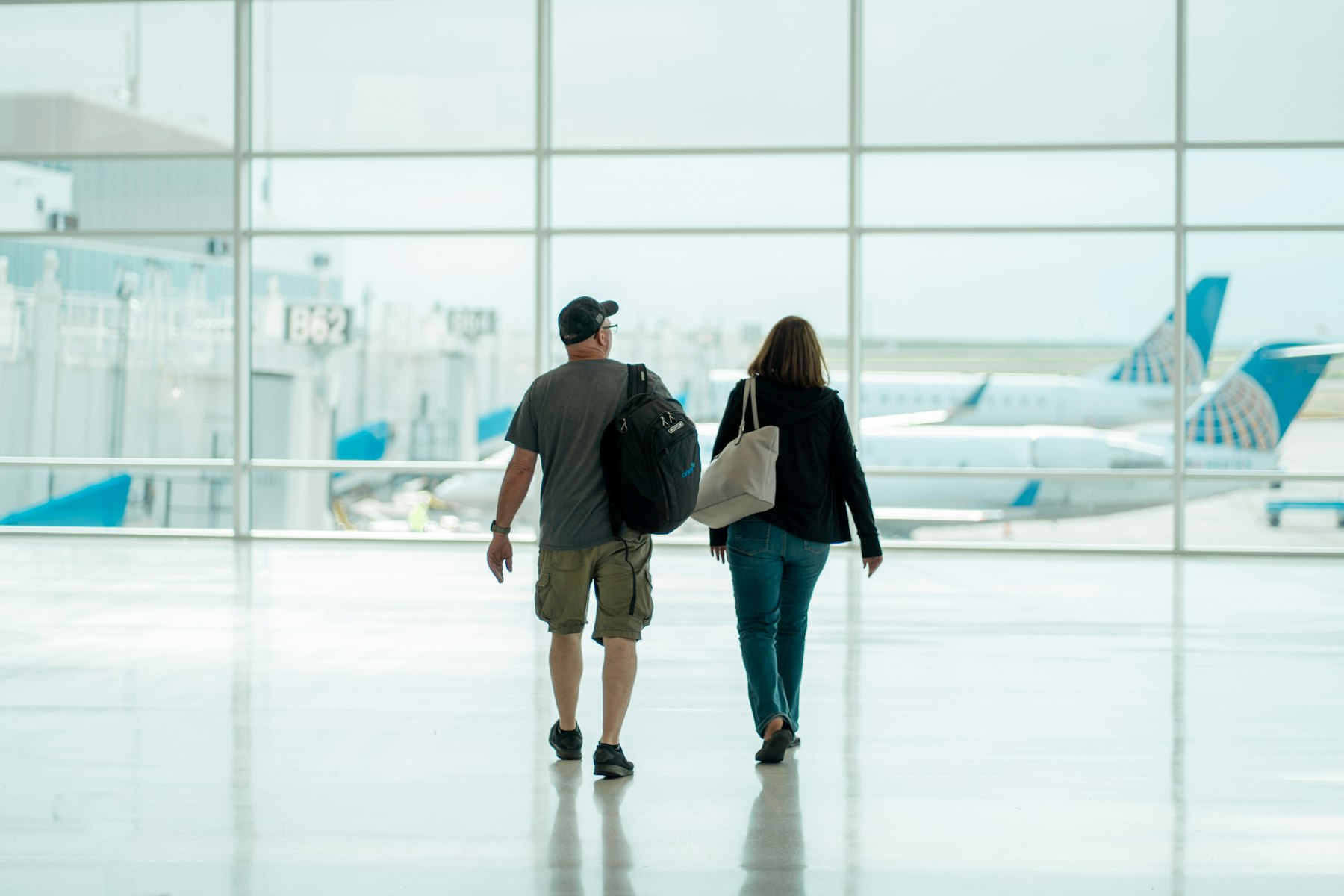 airport-intercity Travellers at an airport window