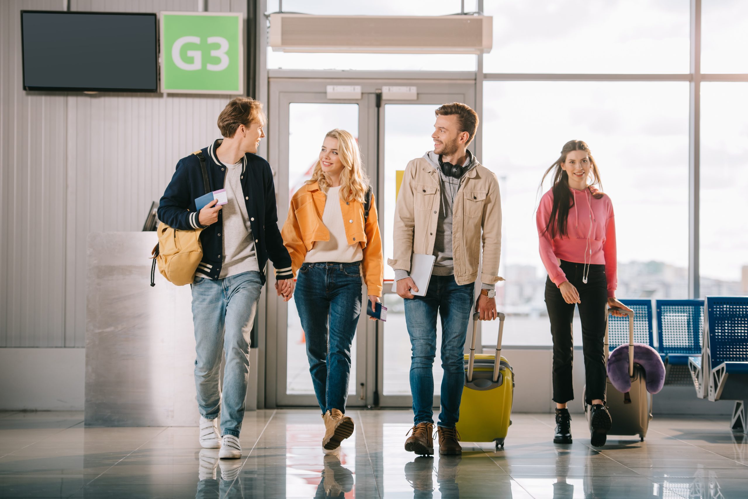 airport-kerbside Students with suitcases at the airport